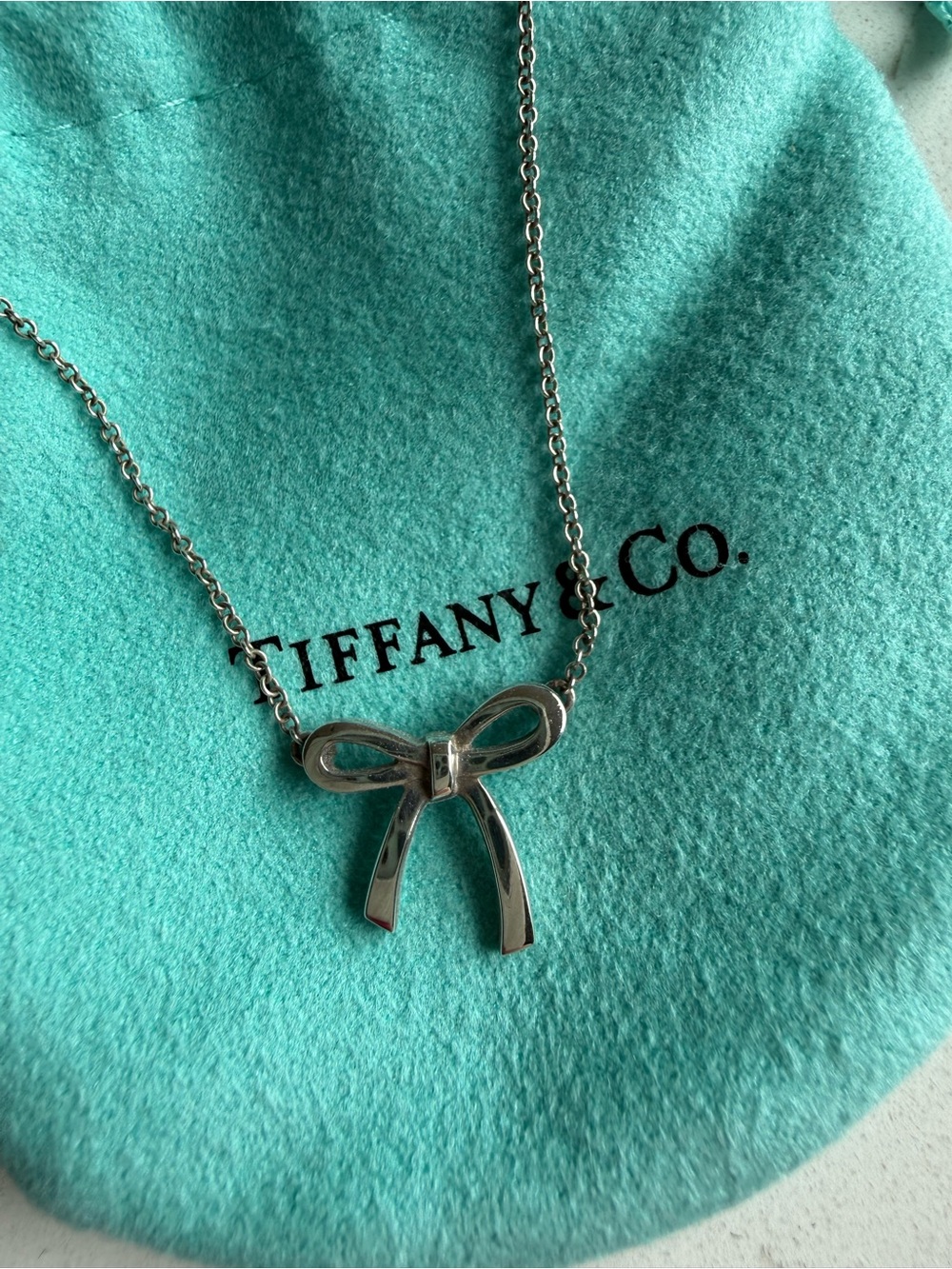 Tiffany & Co. Silver Bow Necklace with Signature Blue Pouch